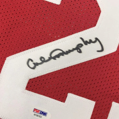 Red athletic jersey with white number and autograph, verified with third party authentication