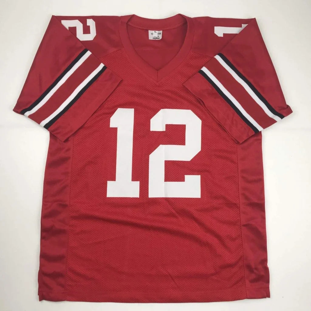 Maroon custom ohio state football jersey with white number 12 and black white striped sleeves for professional sports league