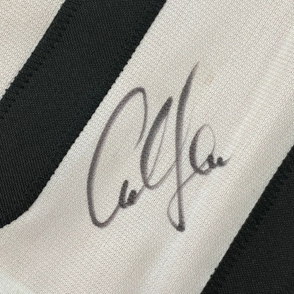 Autographed black and white striped custom jersey for professional sports and sports league fans