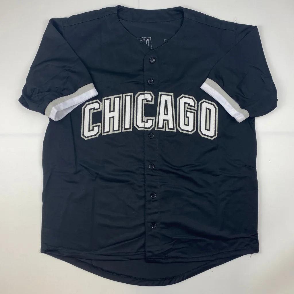 Black Chicago baseball jersey with white lettering and striped sleeves, perfect for professional sports fans