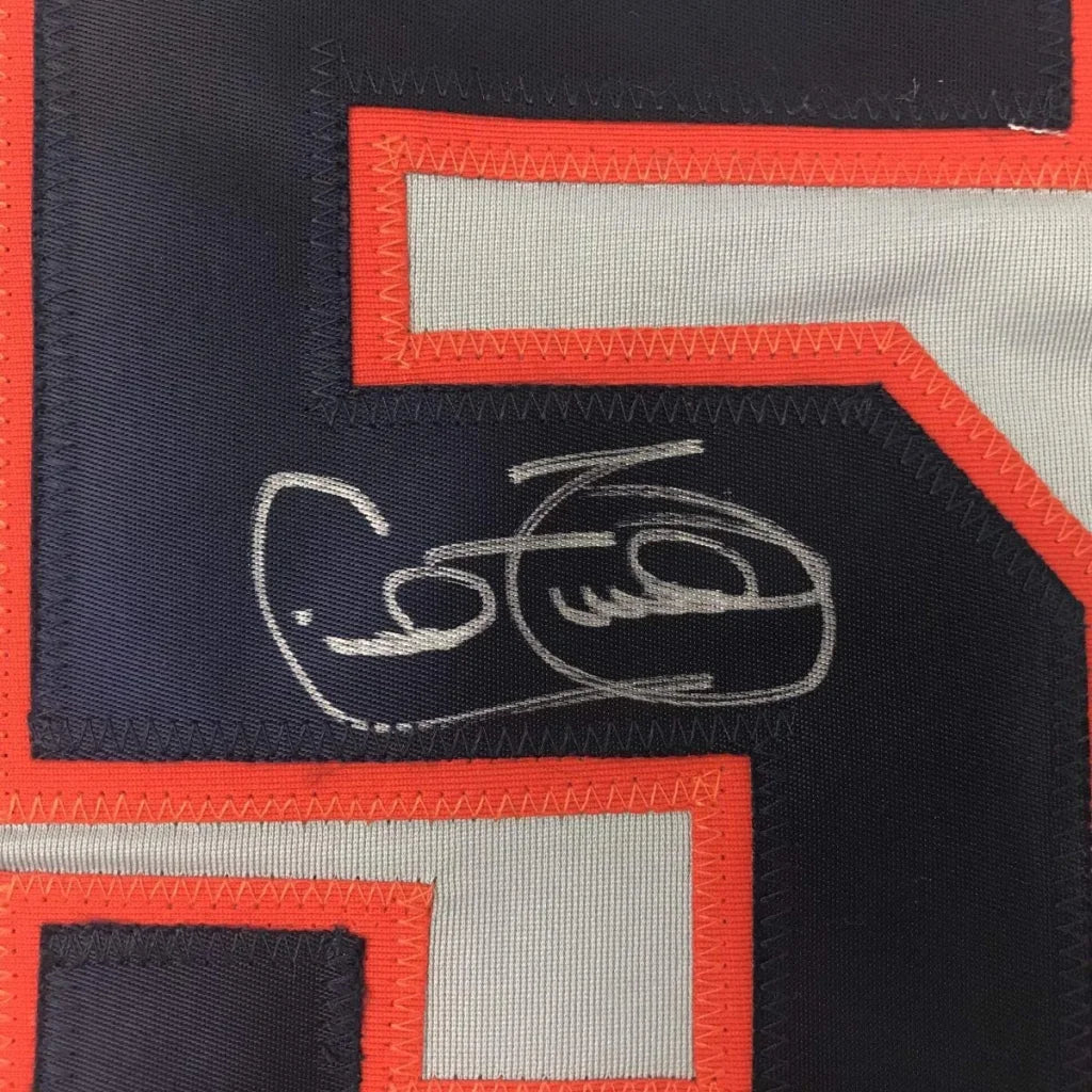 Autographed dark blue custom jersey from professional sports league featuring Cecil Fielder