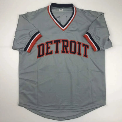 Gray short-sleeve baseball jersey with DETROIT in red and black, perfect for professional sports fans