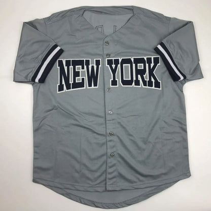 Gray short-sleeved baseball jersey with NEW YORK lettering, perfect for professional sports fans