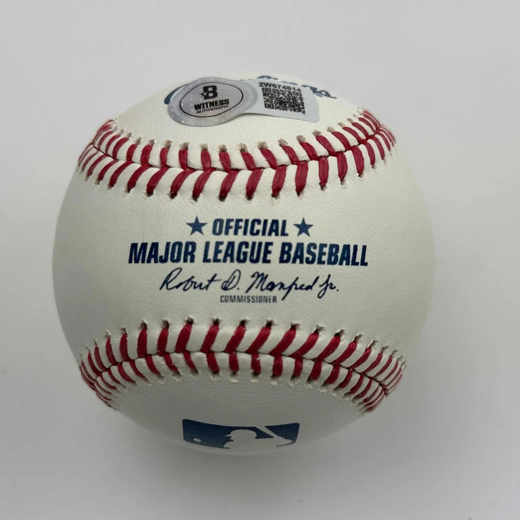 Authentic MLB baseball with red stitching and commissioners signature