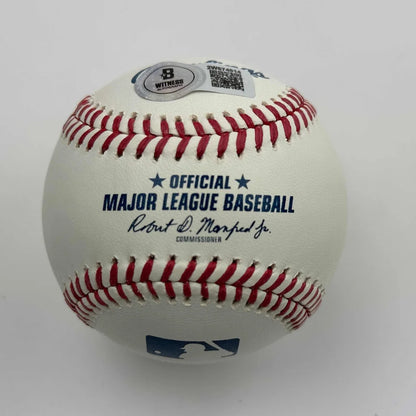 Authentic MLB baseball with red stitching and commissioners signature