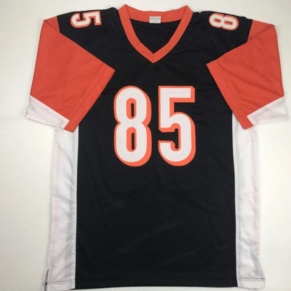 Black and orange custom jersey with number 85 from Authentic Ochocinco autographed memorabilia for professional sports league fans