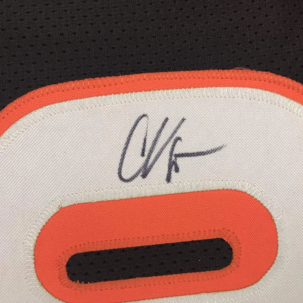 Autographed white custom jersey with orange trim from the professional sports league