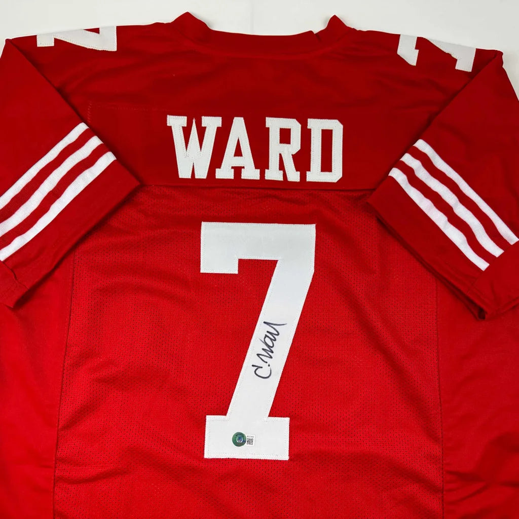Back of an autographed San Francisco 49ers red custom jersey with white ward 7 lettering from professional sports league