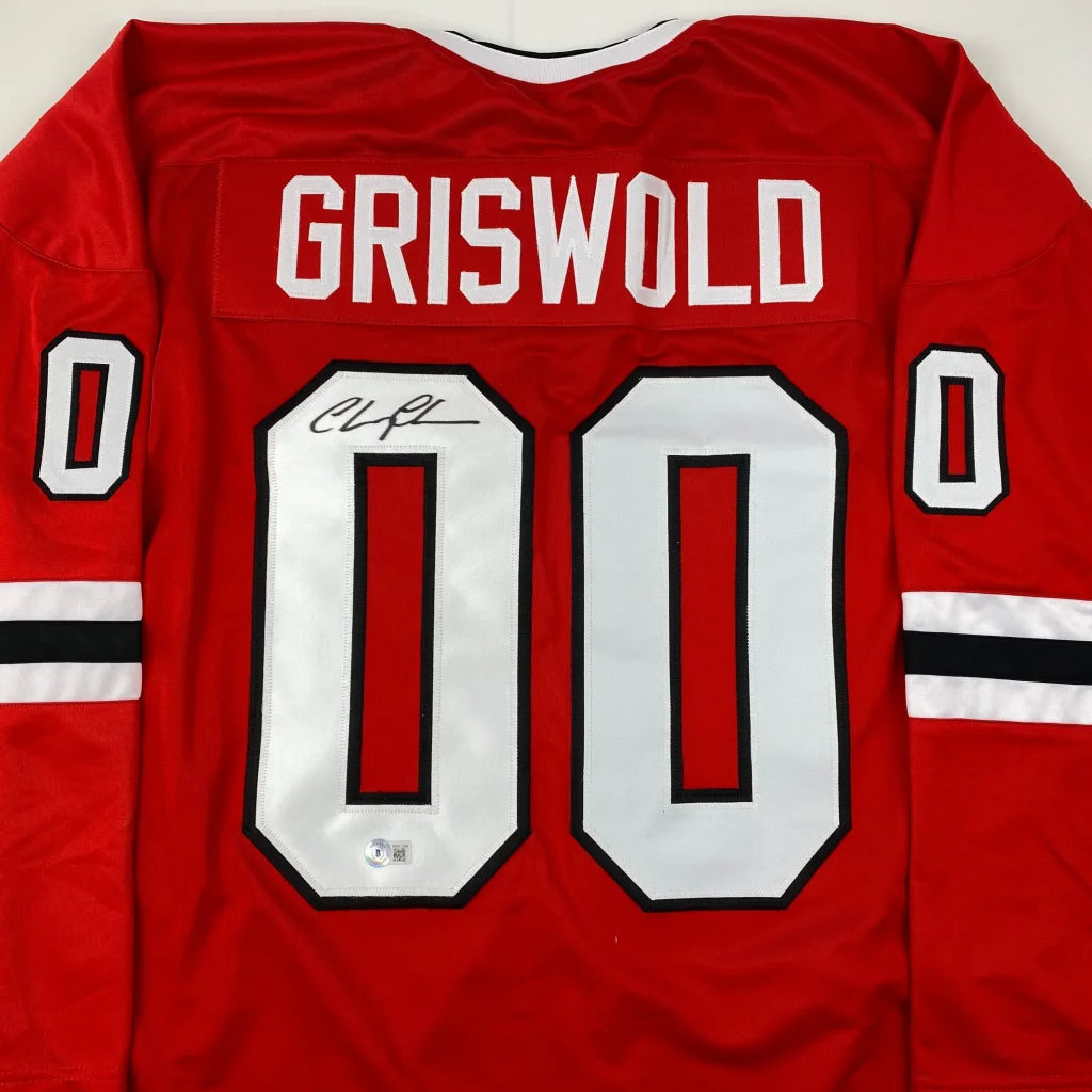 Autographed Chevy Chase Clark Griswold Christmas Vacation Movie Chicago Red Hockey Jersey Beckett BAS COA | Certified Authentic Signed Memorabilia | vintageantiquesgifts.com