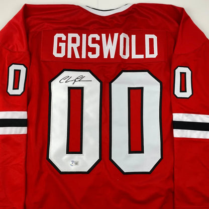Autographed Chevy Chase Clark Griswold Christmas Vacation Movie Chicago Red Hockey Jersey Beckett BAS COA | Certified Authentic Signed Memorabilia | vintageantiquesgifts.com