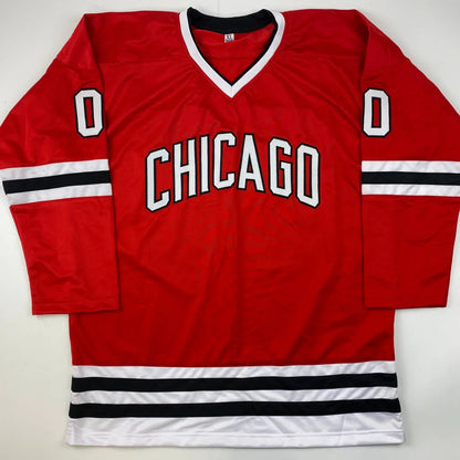 Red hockey jersey with white and black stripes from Authentic Griswold Custom Jersey, a pro sports collectible