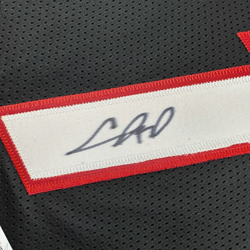 Black custom jersey signed by an unknown pro sports league star Chris Bosh