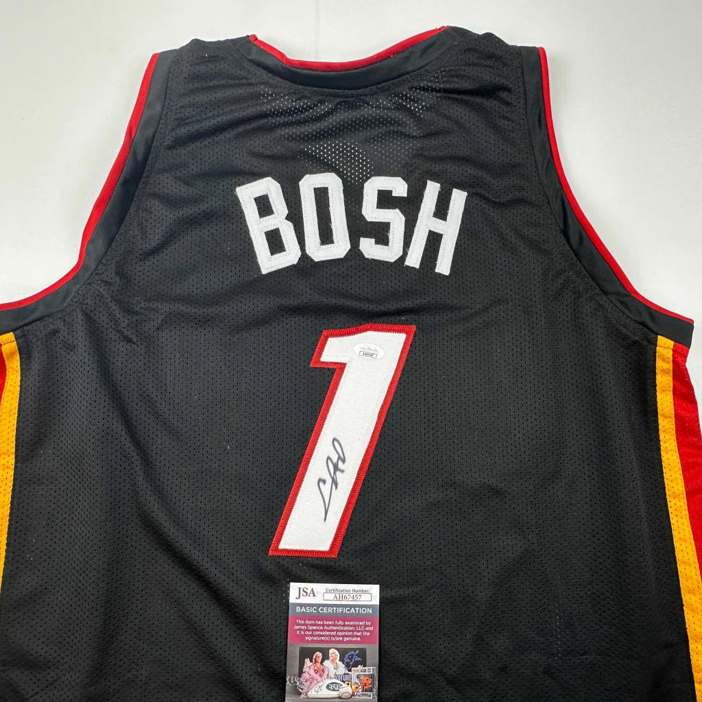 Signed Black Basketball Jersey from Professional Sports League with Chris Bosh autograph and JSA sticker