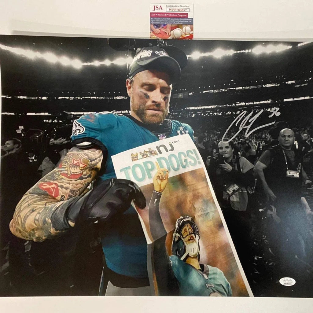 Autographed NFL player photo holding newspaper in product Authenticated NFL Autographed Photo