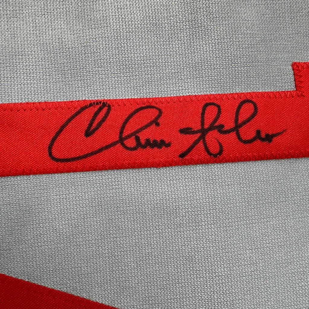 Red ribbon with a black autograph on custom jersey from Professional Sports baseball collectible