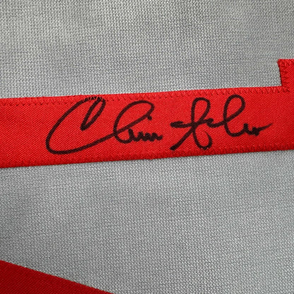 Red ribbon with a black autograph on custom jersey from Professional Sports baseball collectible