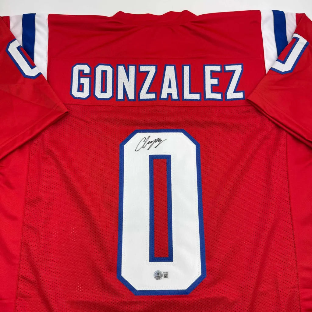 Back of autographed Christian Gonzalez New England red custom football jersey, Gonzalez 0