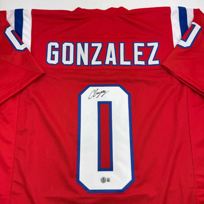 Back of autographed Christian Gonzalez New England red custom football jersey, Gonzalez 0