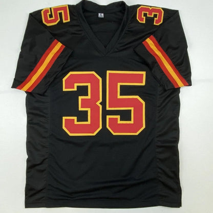Black football jersey with red and yellow accents from Christian Okoye NFL professional sports collectible