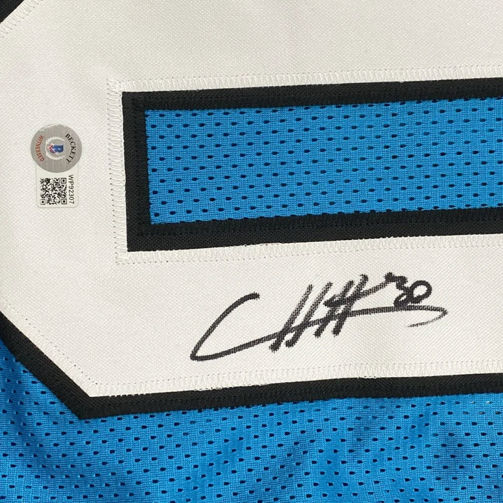 Autographed blue Chuba Hubbard custom jersey from professional sports league with Beckett sticker
