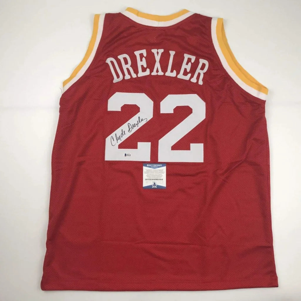 Autographed Clyde Drexler red custom jersey with number 22, professional sports league