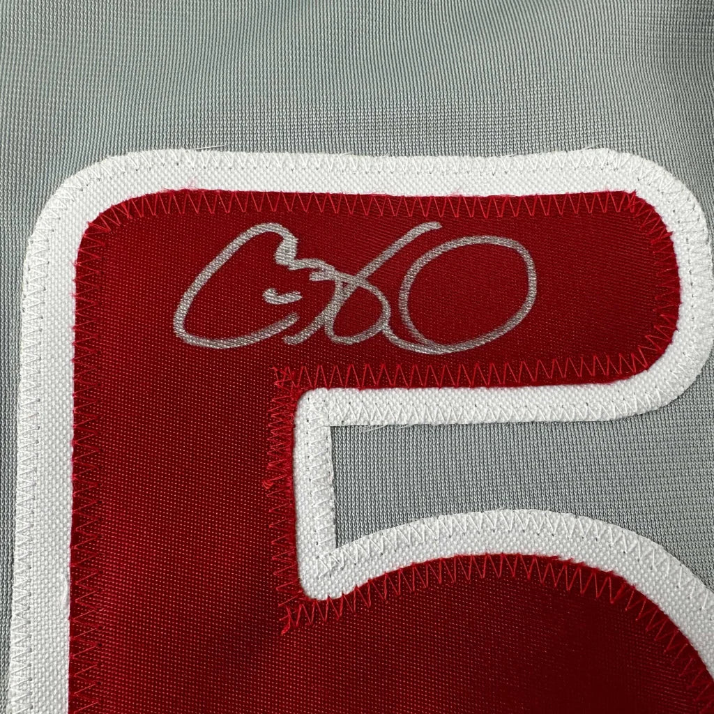 Red and white custom jersey with number 5, autographed by a professional sports star