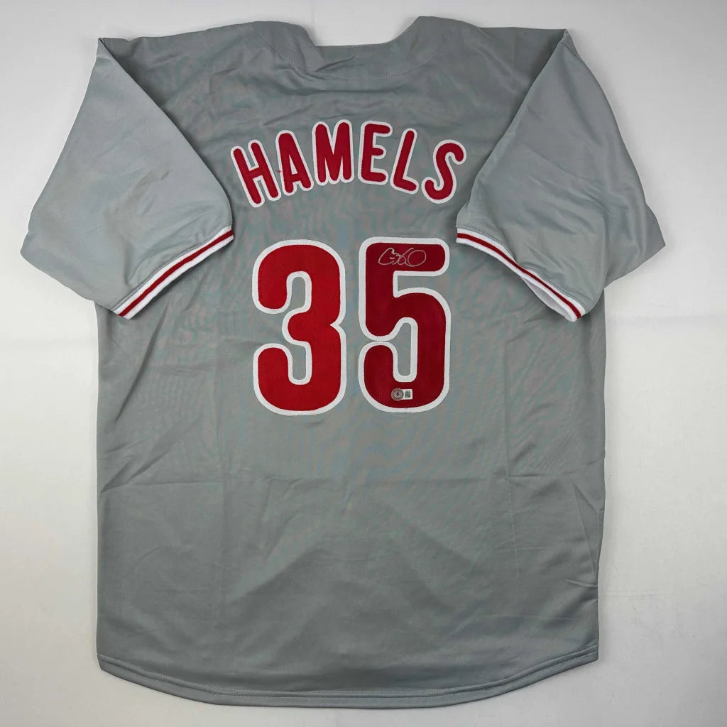 Gray professional sports custom jersey with red numbers and white trim for sports league