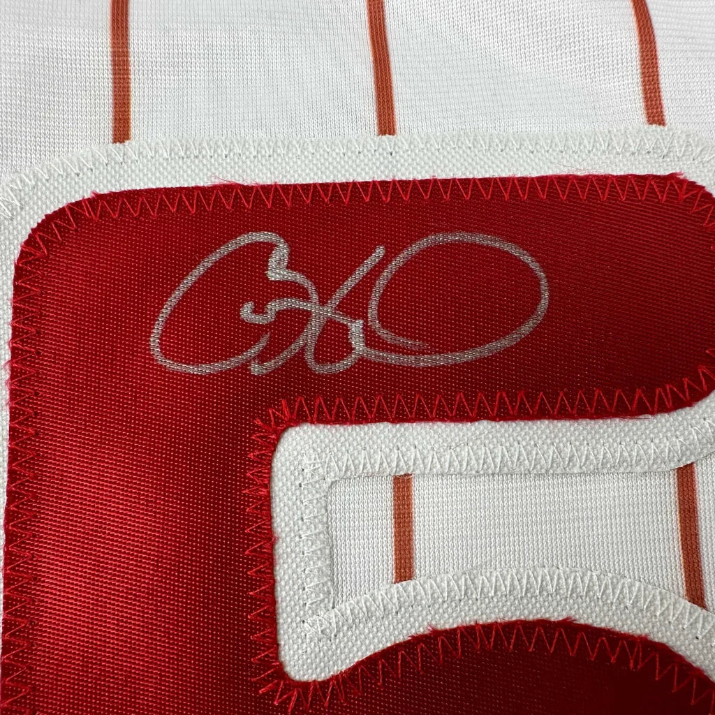 Red and white striped Cole Hamels Philadelphia pinstripe professional sports jersey with autograph