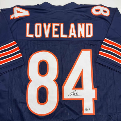 Back of autographed Colston Loveland Chicago Bears custom jersey, navy blue orange number 84
