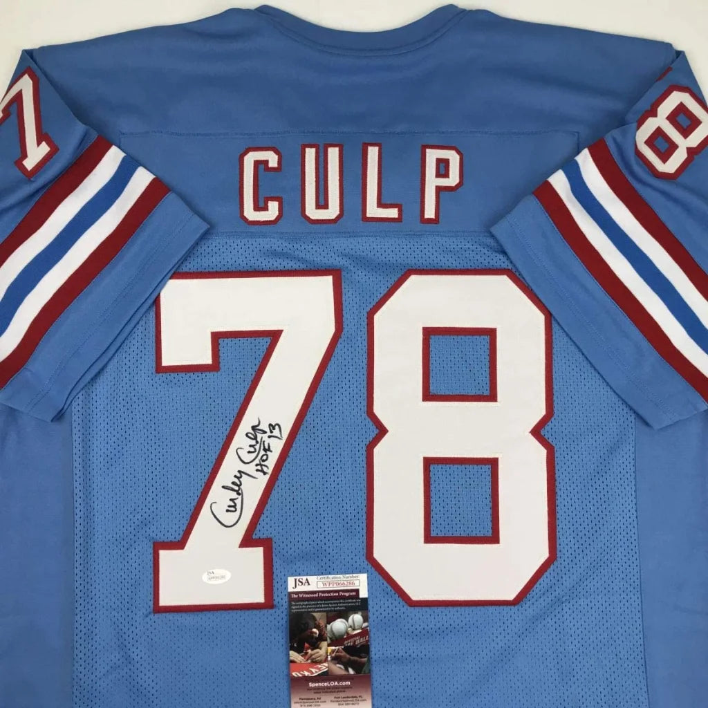 Back of a blue custom jersey signed by curley culp featuring white and red lettering 78 from a professional sports league