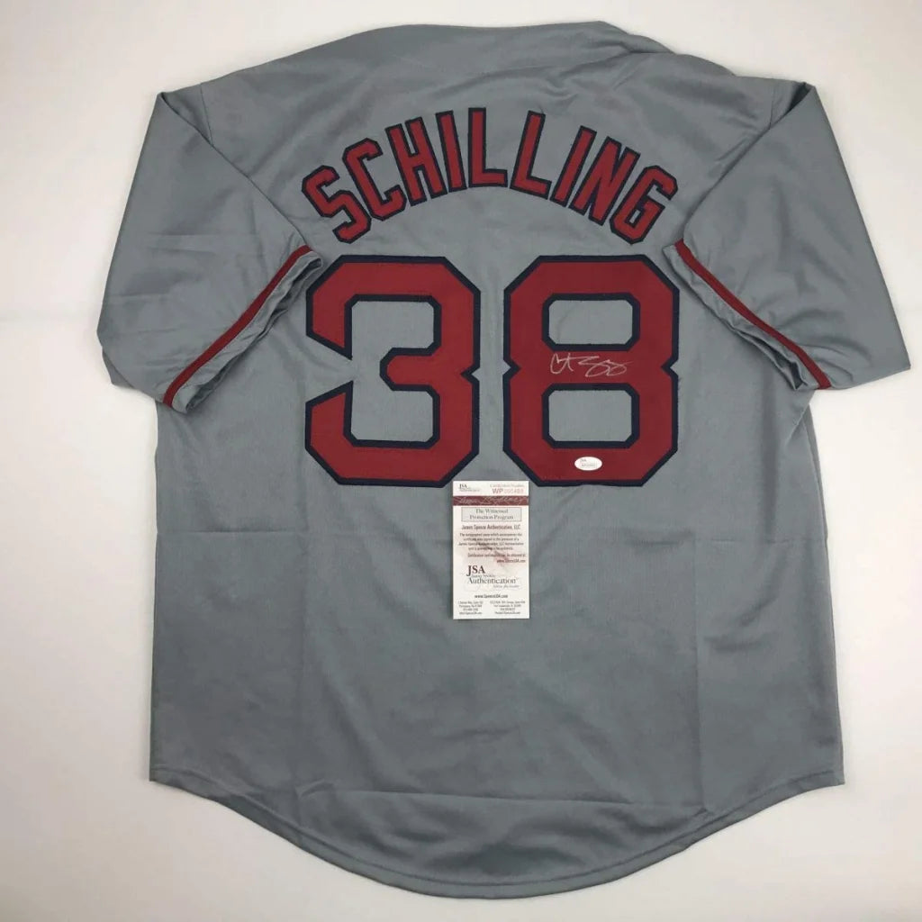 Gray custom jersey from professional sports league with Schilling 38 and signed number 8