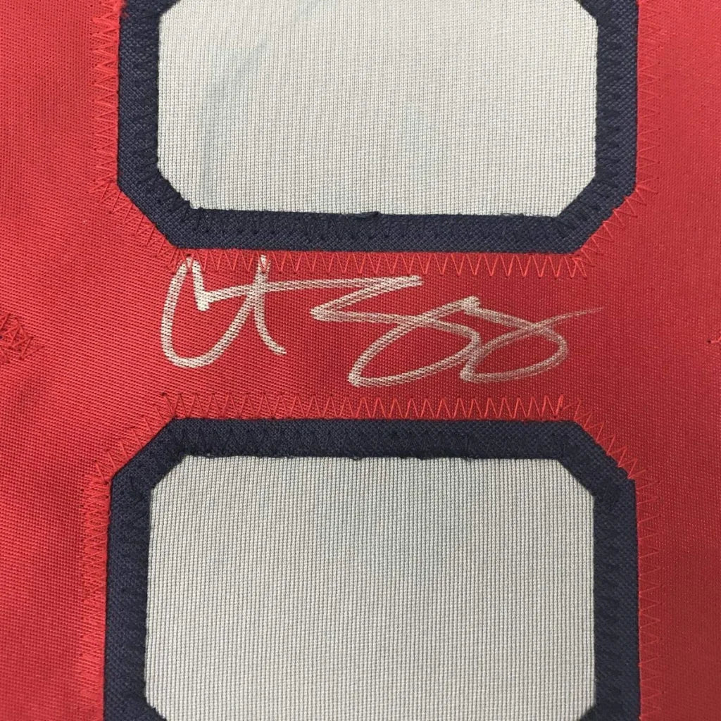 Red and white custom sports jersey with autograph from Professional Sports League