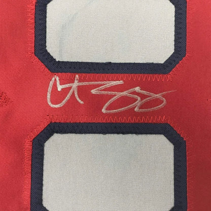 Red and white custom sports jersey with autograph from Professional Sports League