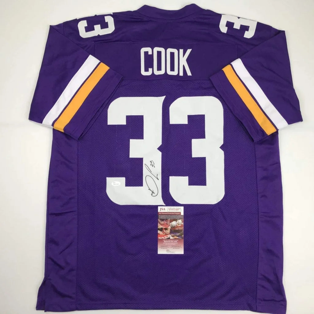 Back view of autographed dalvin cook minnesota vikings purple football custom jersey with white and gold stripes professional sports league