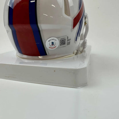 White mini Buffalo Bills helmet with red and blue stripes and Beckett COA sticker