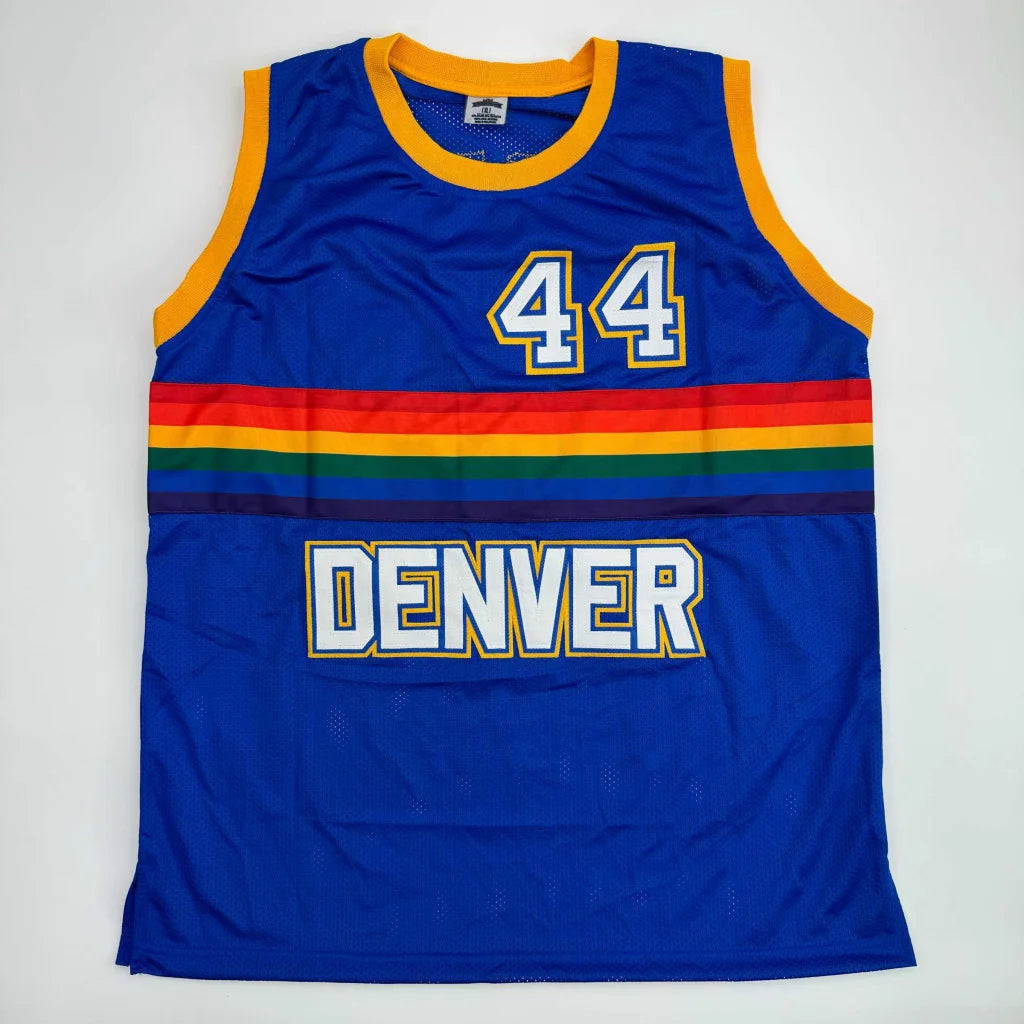 Blue sleeveless custom basketball jersey from professional sports league with rainbow stripes