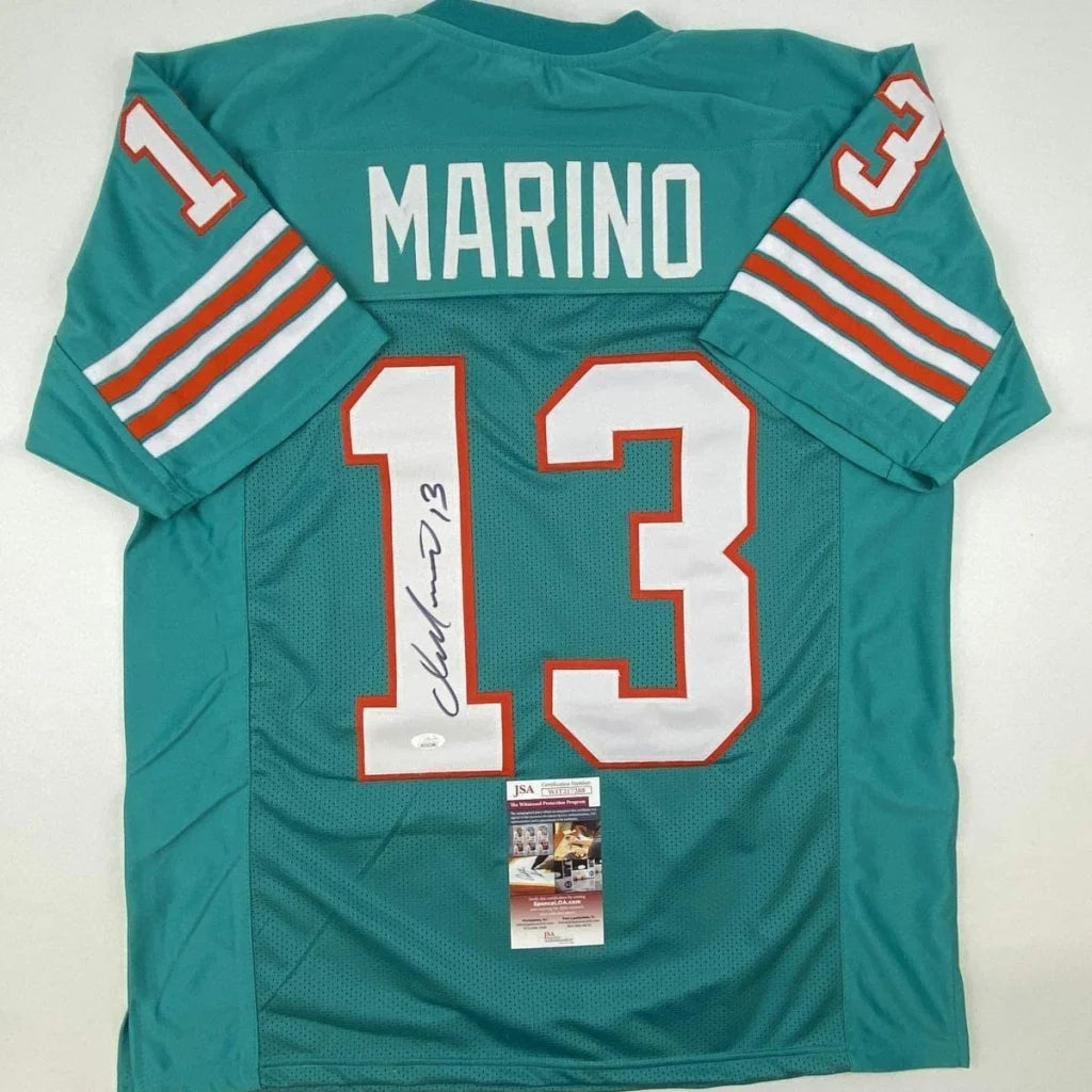 Autographed Dan Marino teal Miami Dolphins custom jersey with number 13, professional sports league