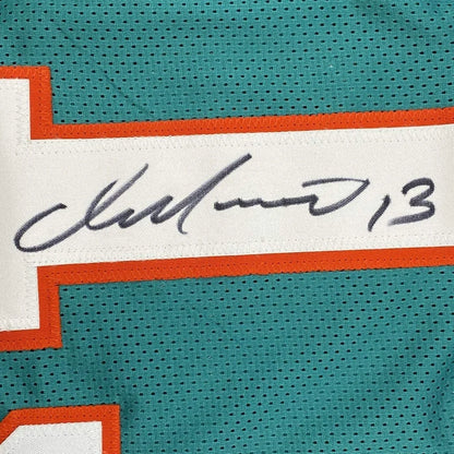 Autographed teal and orange custom jersey from a professional sports league featuring Dan Marino