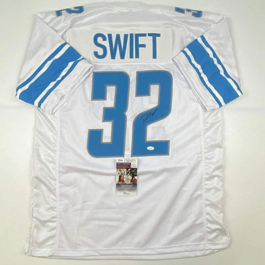 Back of a custom white and blue detroit lions professional sports jersey with swift 32 mesh fabric and signature