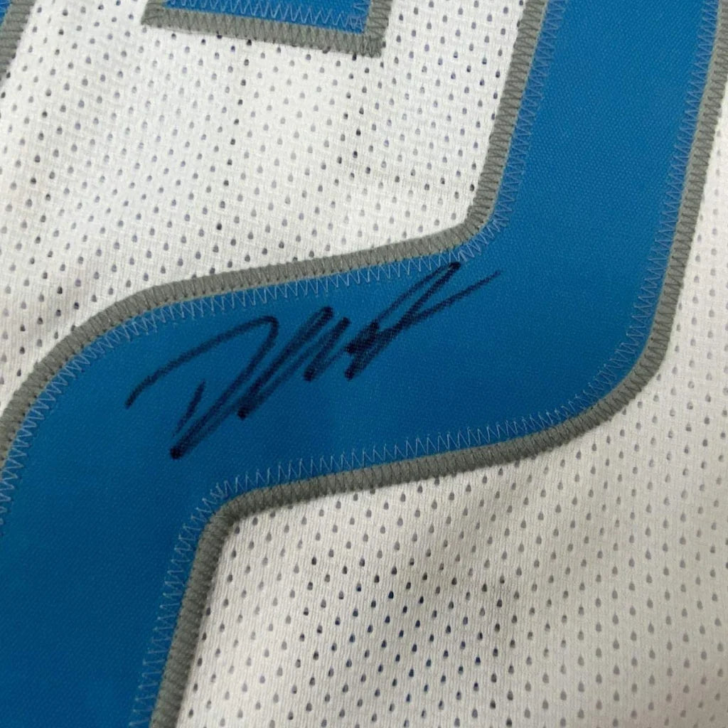 Blue and white mesh custom jersey with gray trim featuring a black ink signature from professional sports league player