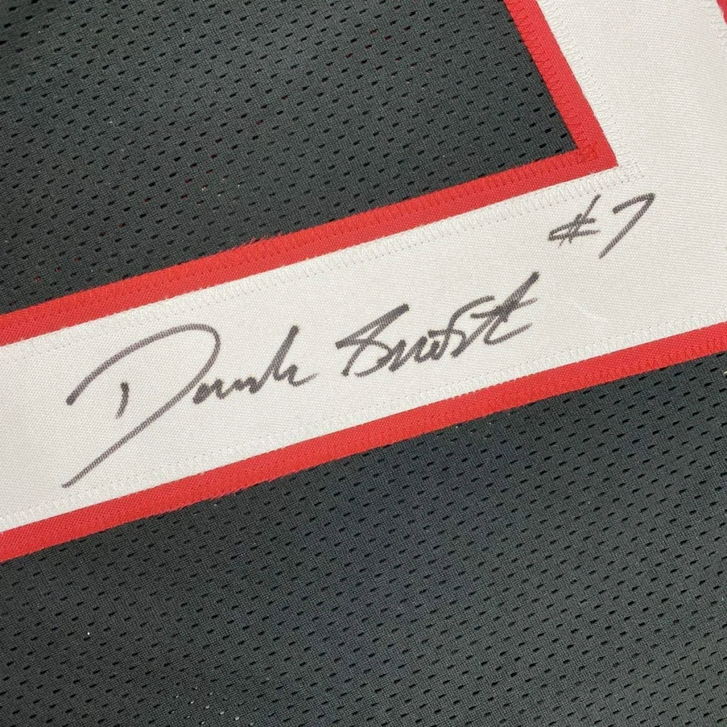 Black custom jersey with white and red trim and autograph from a pro sports league