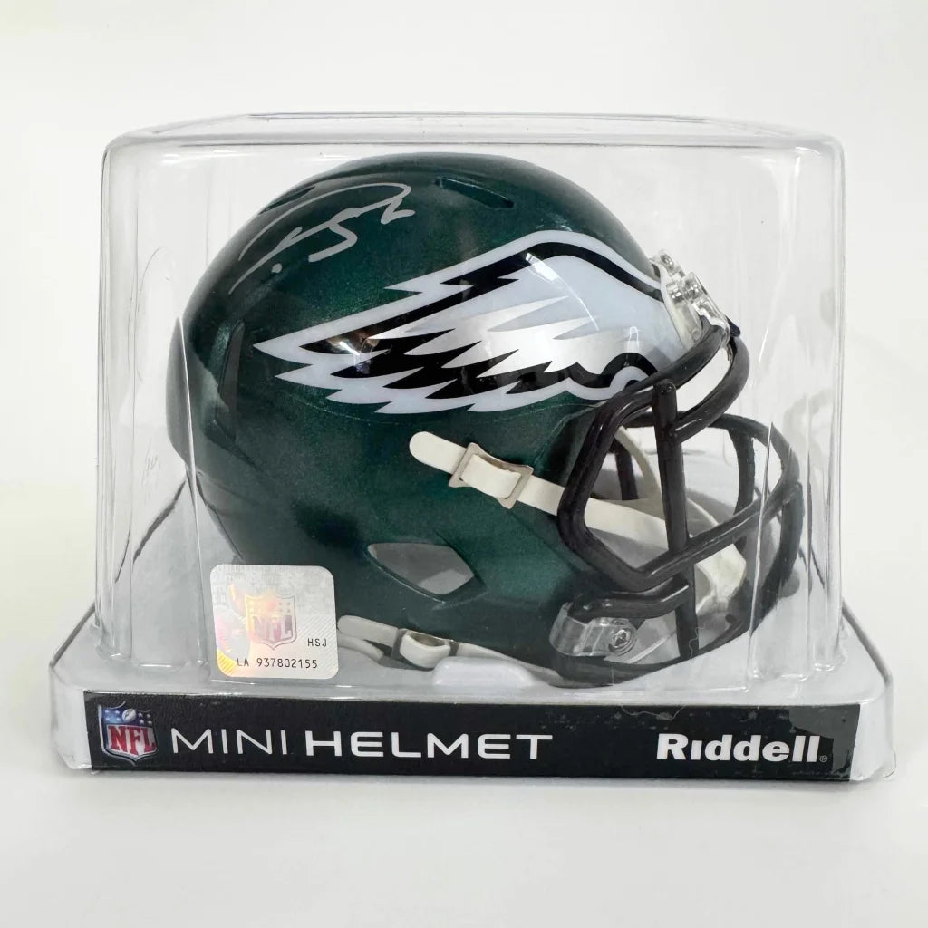 Green Philadelphia Eagles mini helmet in clear display case, perfect for fans and collectors