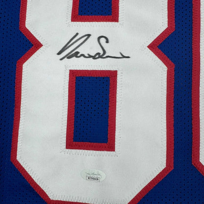 Blue and white custom jersey with red trim and black autograph from Slayton Professional Sports League