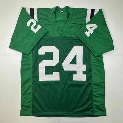 Green football jersey with white 24 number from Own This Epic Revis 24 autographed professional sports jersey