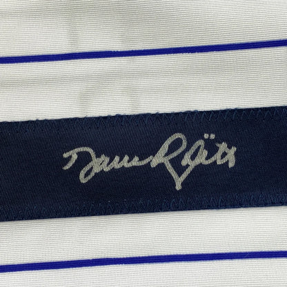 White fabric with blue pinstripes and silver signature on custom jersey for professional sports fans