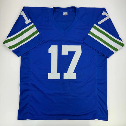 Blue custom jersey with white 17 and green white stripes for professional sports league fans