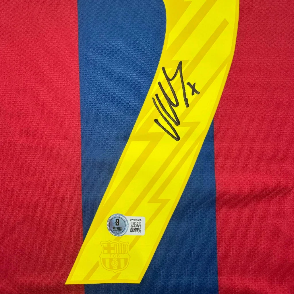 Autographed David Villa FC Barcelona jersey with yellow lightning bolt, black signature, authentication sticker on red blue stripes