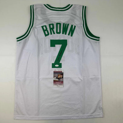 Back of autographed dee brown boston white mesh basketball jersey with green trim brown 7 in bold font