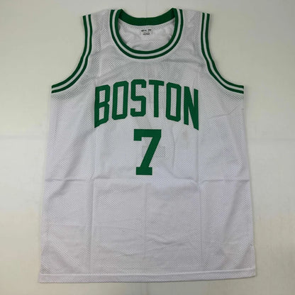 Autographed white mesh basketball jersey with green trim and Boston 7 printed in bold green lettering