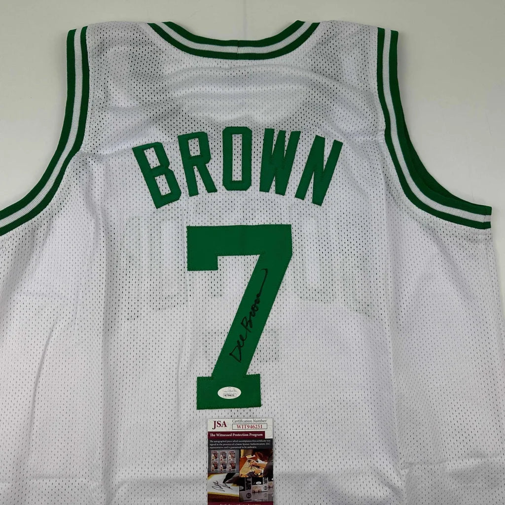 White mesh autographed dee brown boston basketball jersey with green lettering and number 7 on the back side